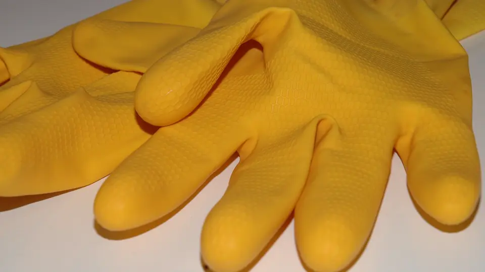 Rubber gloves and cleaning tools on a cart
